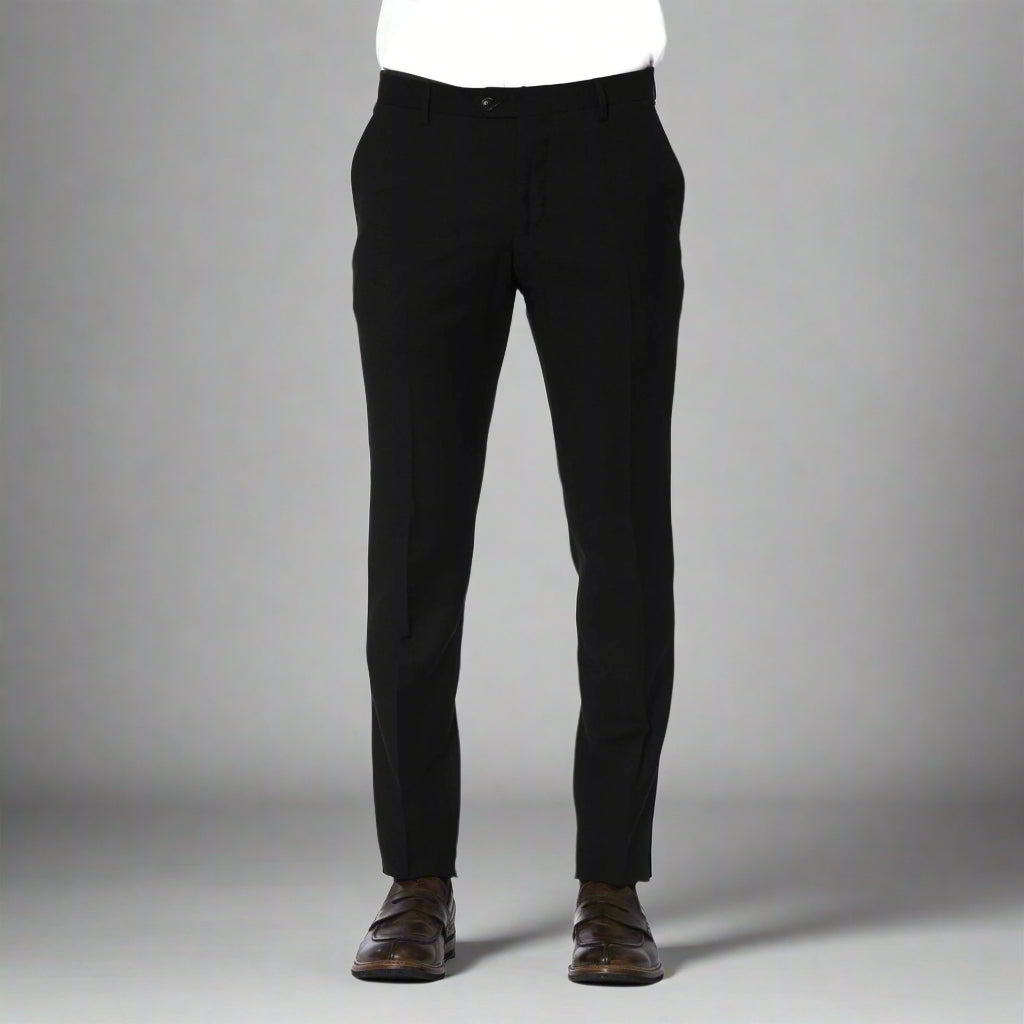 A pair of Trussardi brand trousers displayed on a model, color black, with visible logo on the right pocket, slim fit design, with the model wearing brown shoes.