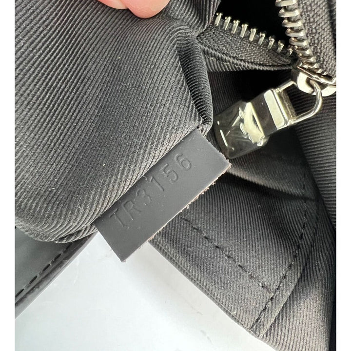 Gray jacket with a visible brand tag on a white background