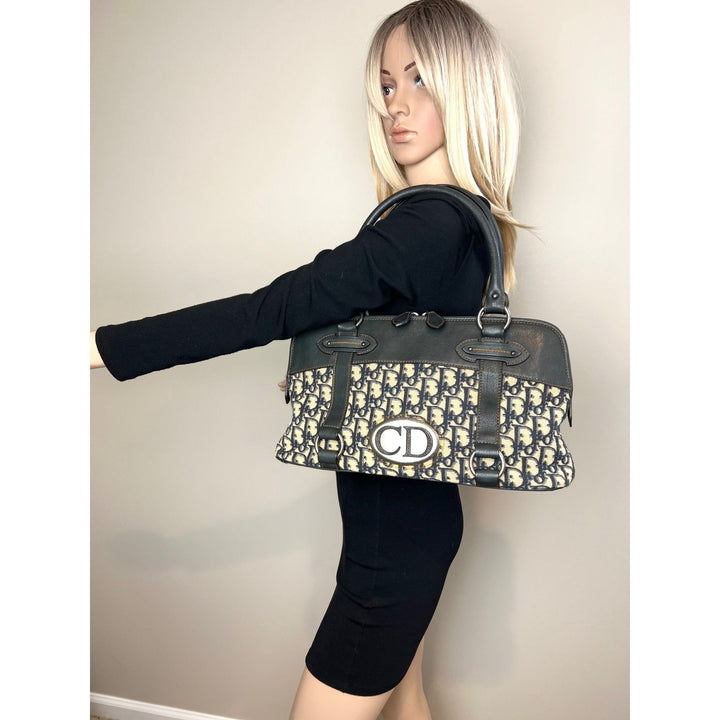 Woman modeling CHRISTIAN DIOR Monogram Trotter CD Blue Canvas Hand Bag, showcasing luxury bags style.