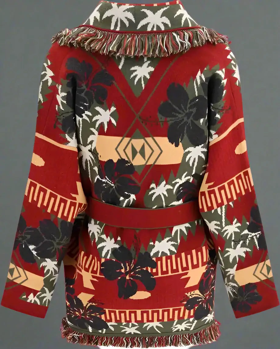 Red patterned sweater with floral and geometric design on a white background