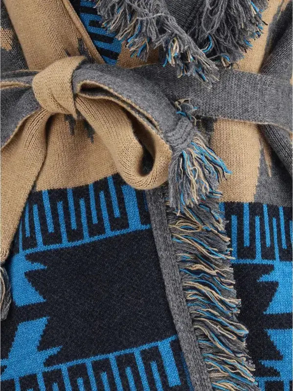 Close-up of a woven fabric with geometric pattern featuring blue, black, and beige colors.