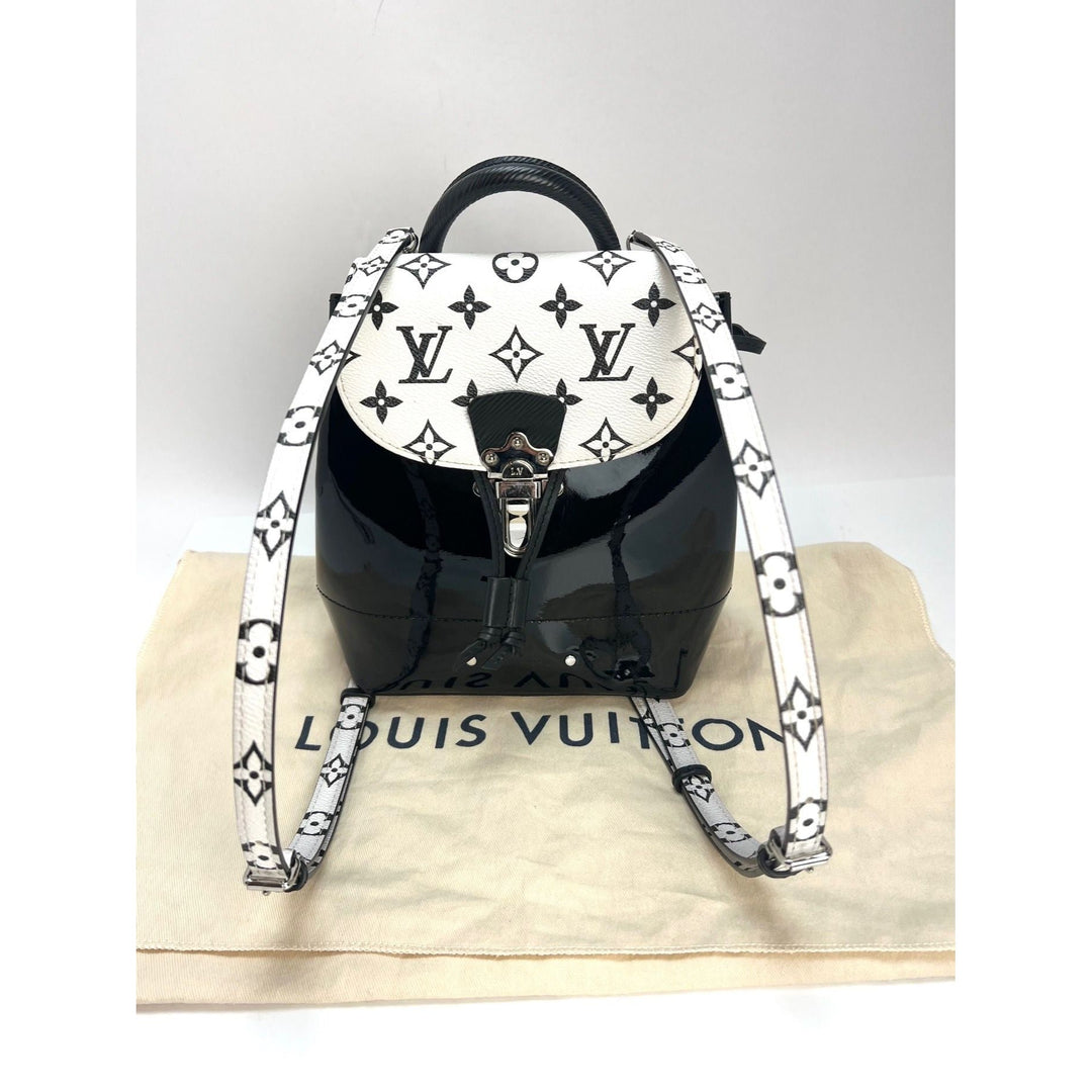 LOUIS VUITTON Hot Springs Backpack White Monogram and Patent Leather on LV dust bag, showcasing luxury bags design.