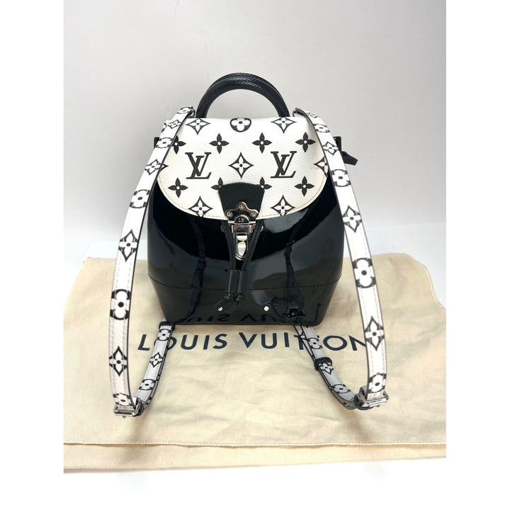 LOUIS VUITTON Hot Springs Backpack White Monogram and Patent Leather on LV dust bag, showcasing luxury bags design.