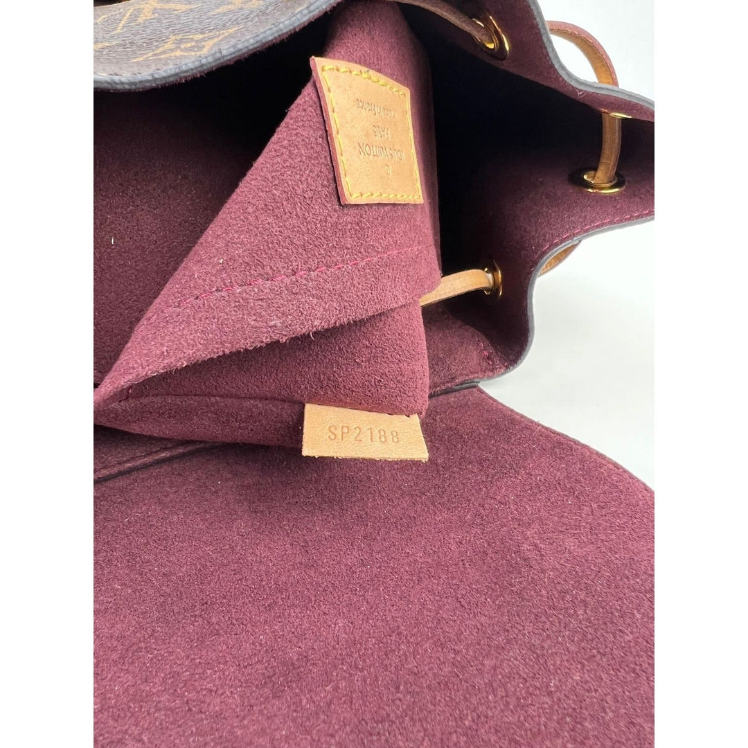 Interior view of LOUIS VUITTON Montsouris NM Monogram Backpack showing marron microfiber and authentic label.