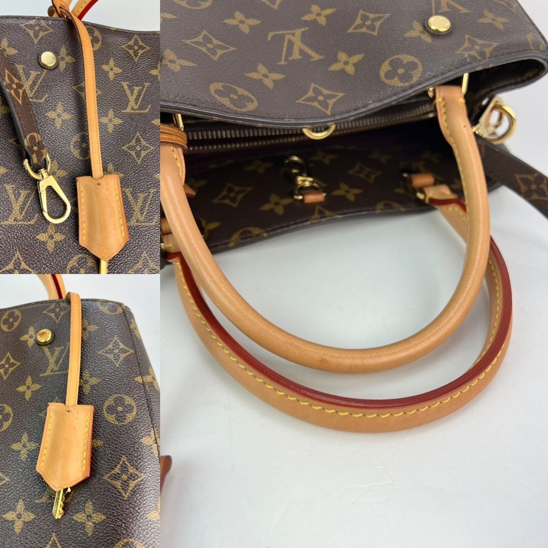 Close-up of a brown handbag with monogram pattern and tan handle and strap on a white background.
