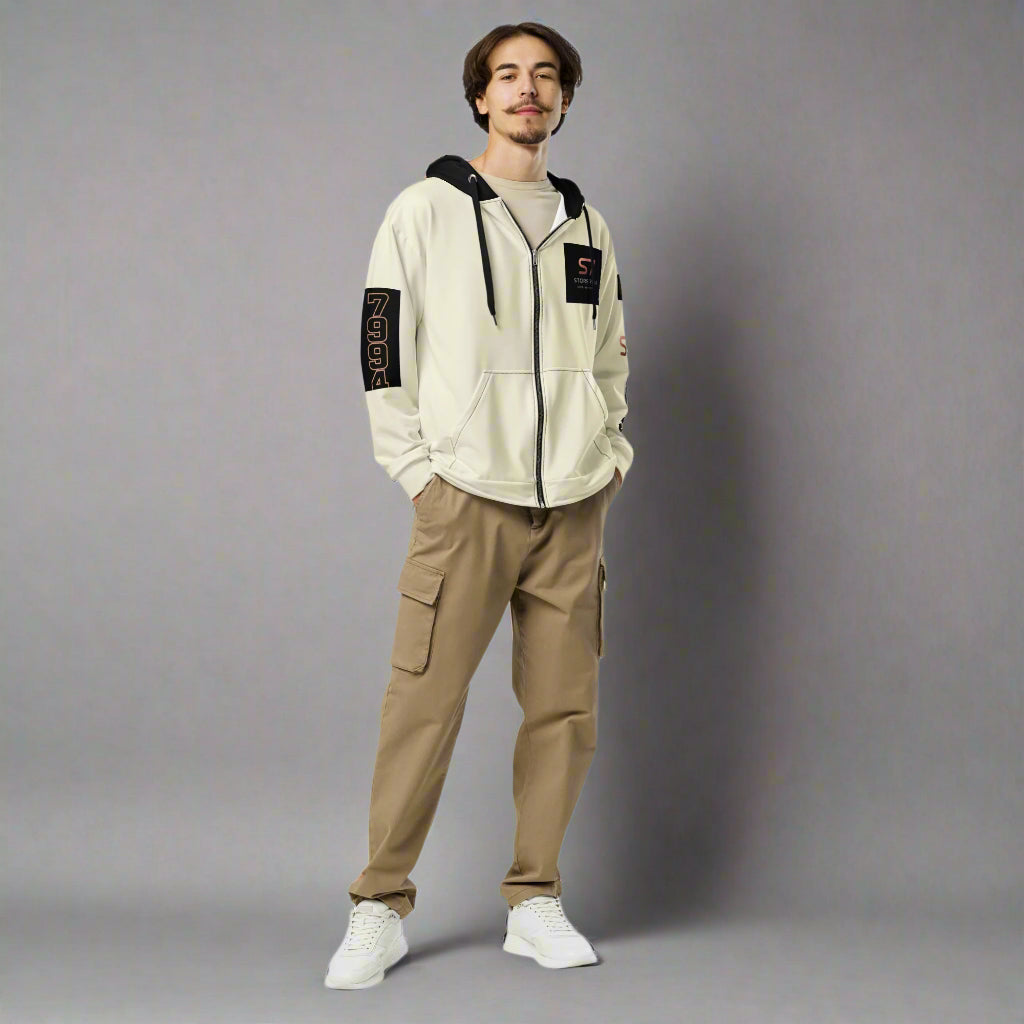 Man in creme colored hoodie