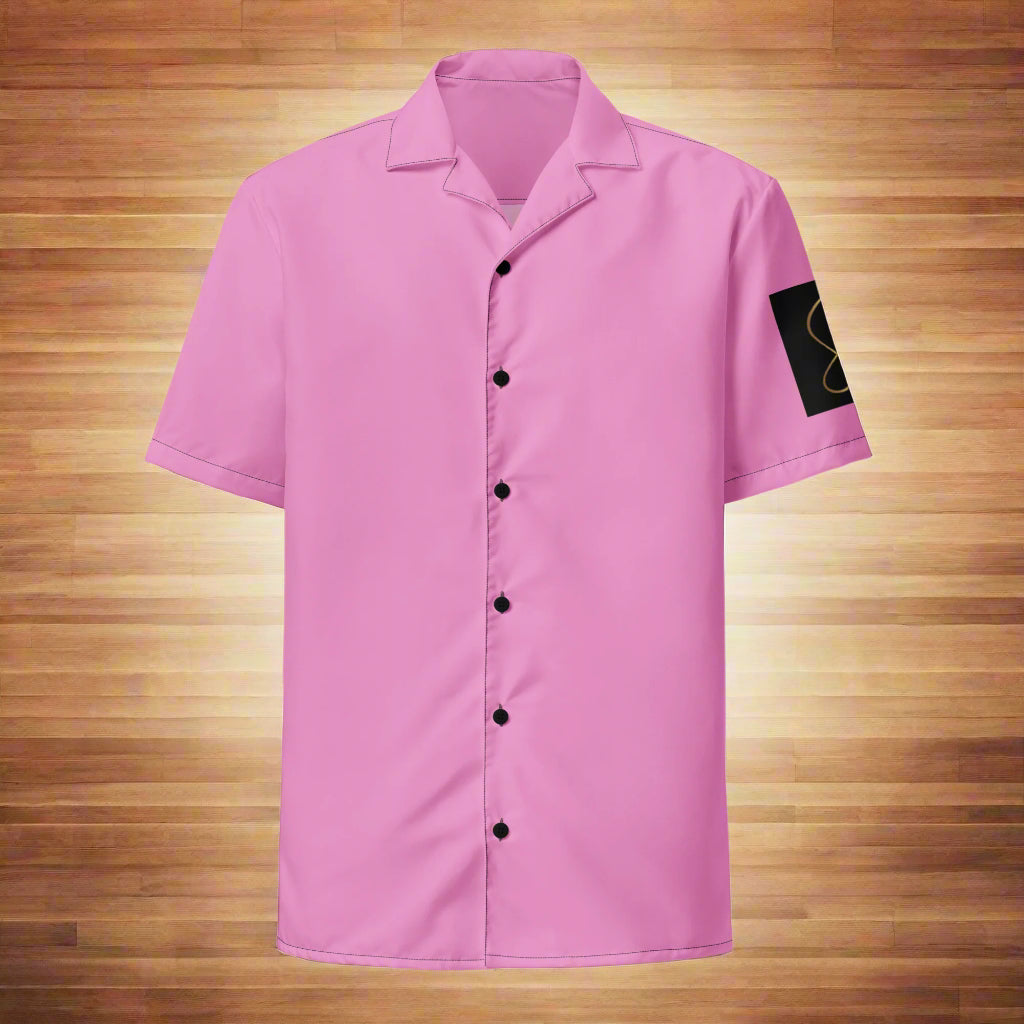 A pink unisex button-up shirt with a graphic of two salsa dancers on the front, set against a sunset backdrop.