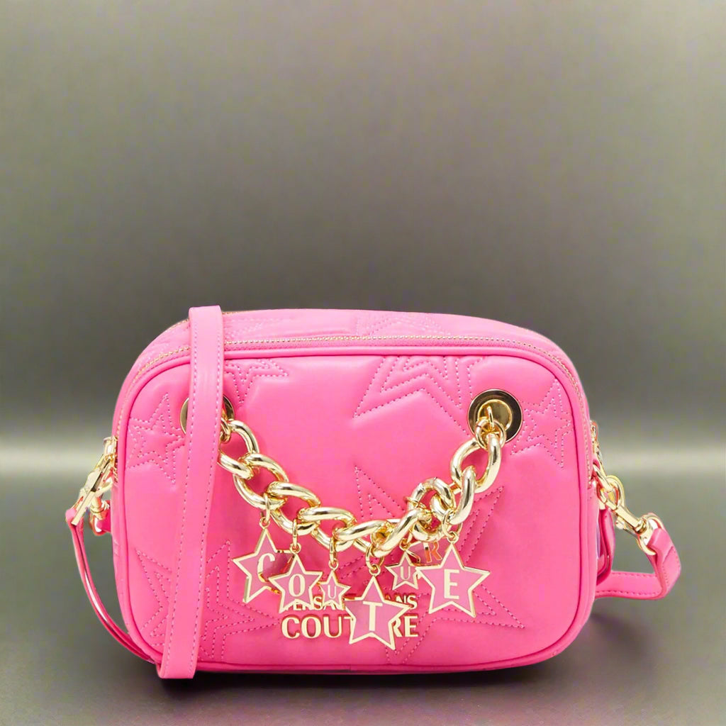 Versace Jeans Couture synthetic leather crossbody bag in pink with gold emblem and shoulder strap, stylish and trendy.