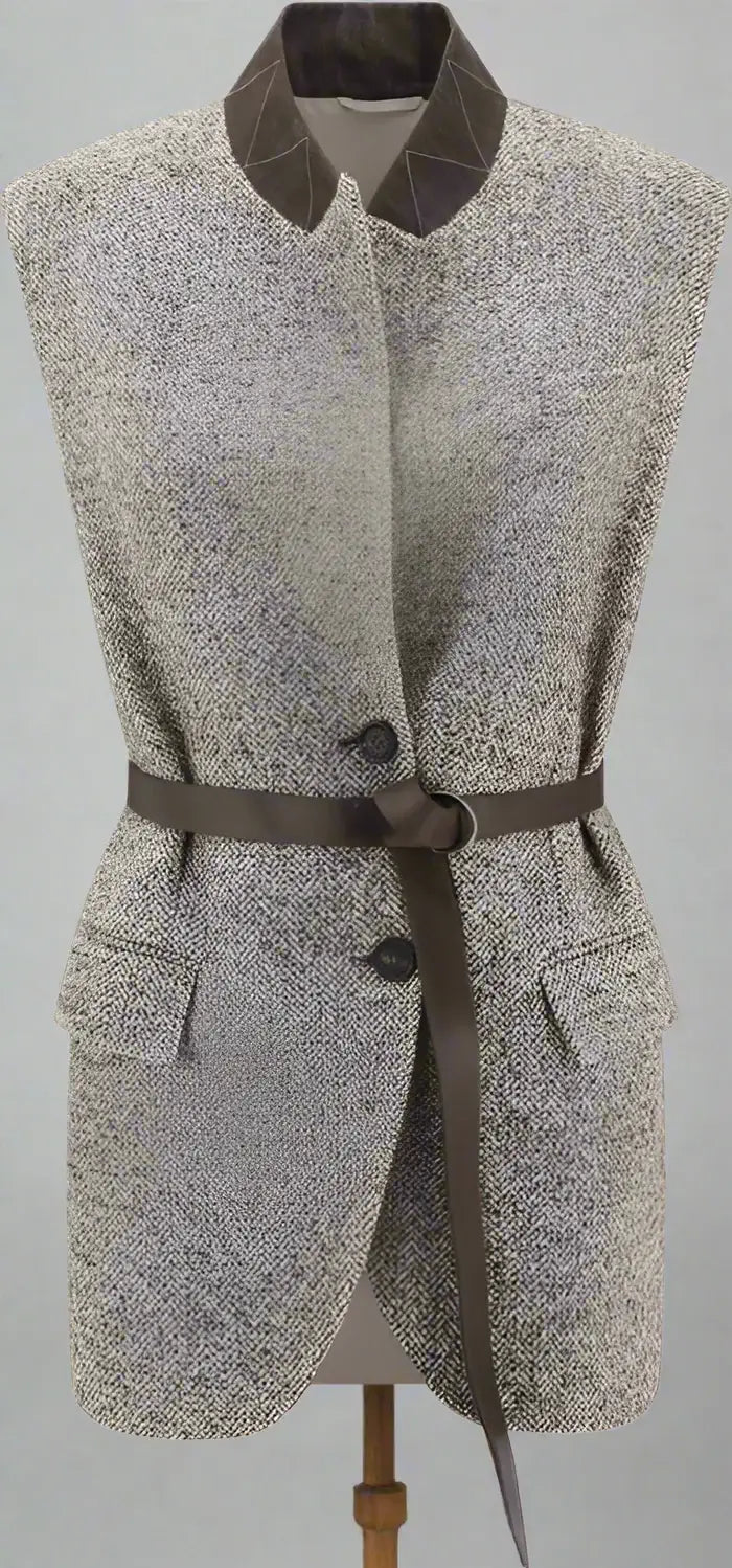 Gray patterned vest with a belt on a white background