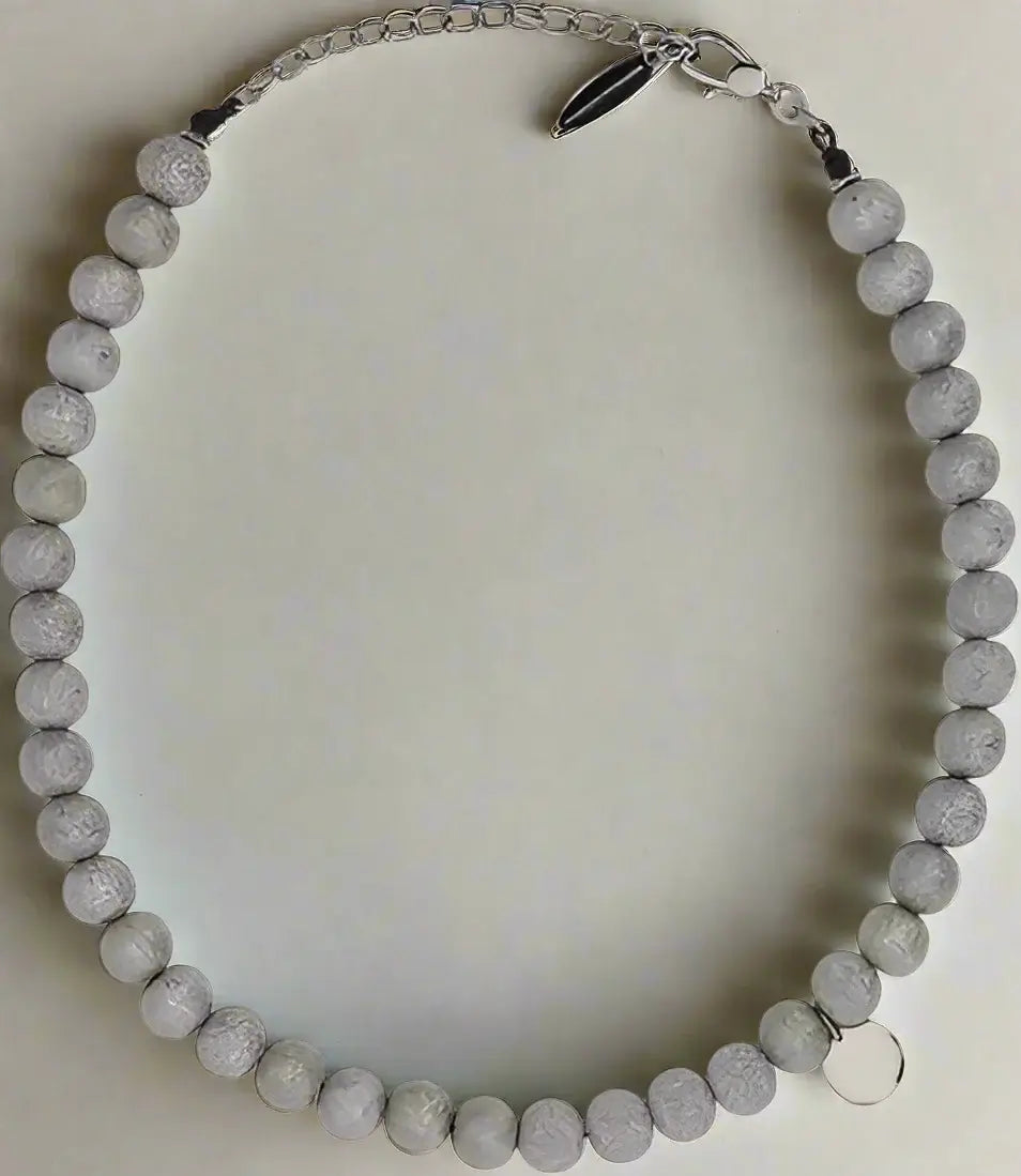 Necklace with gray beads on a white background