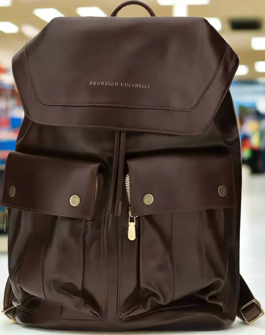 Brown backpack with visible brand name on a white background
