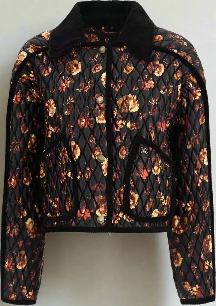 Floral quilted jacket with black collar on a white background