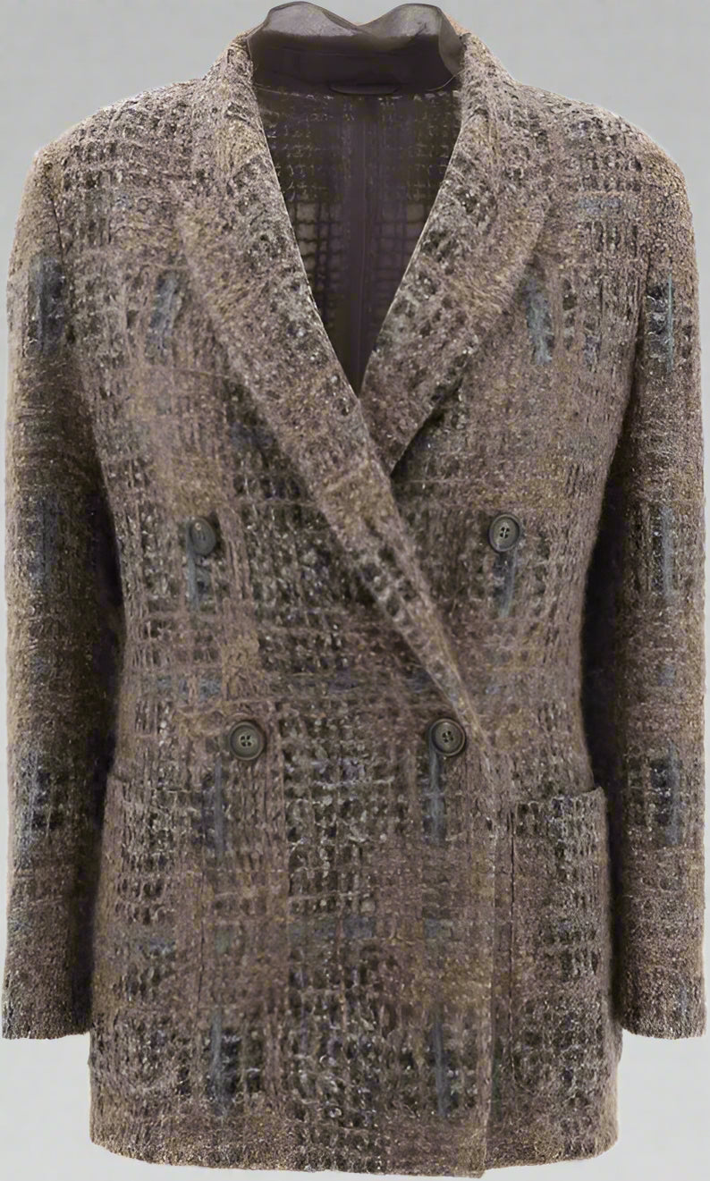 Patterned coat on a mannequin against a plain background