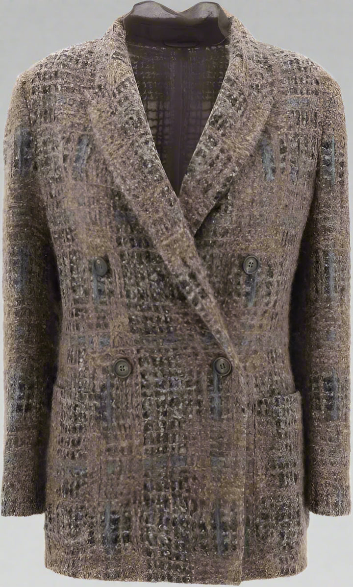 Patterned coat on a mannequin against a plain background
