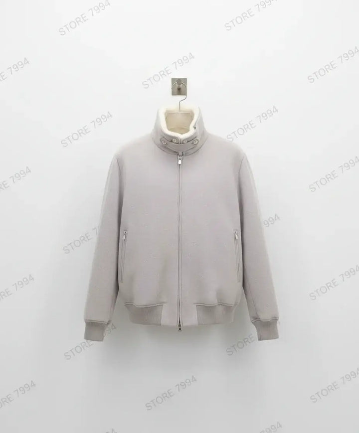 Gray zip-up sweater on a white background