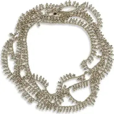 Silver necklace with intricate design on a white background