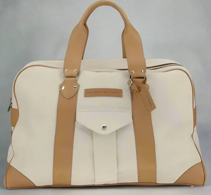 Beige and brown travel bag with visible brand name on a white background