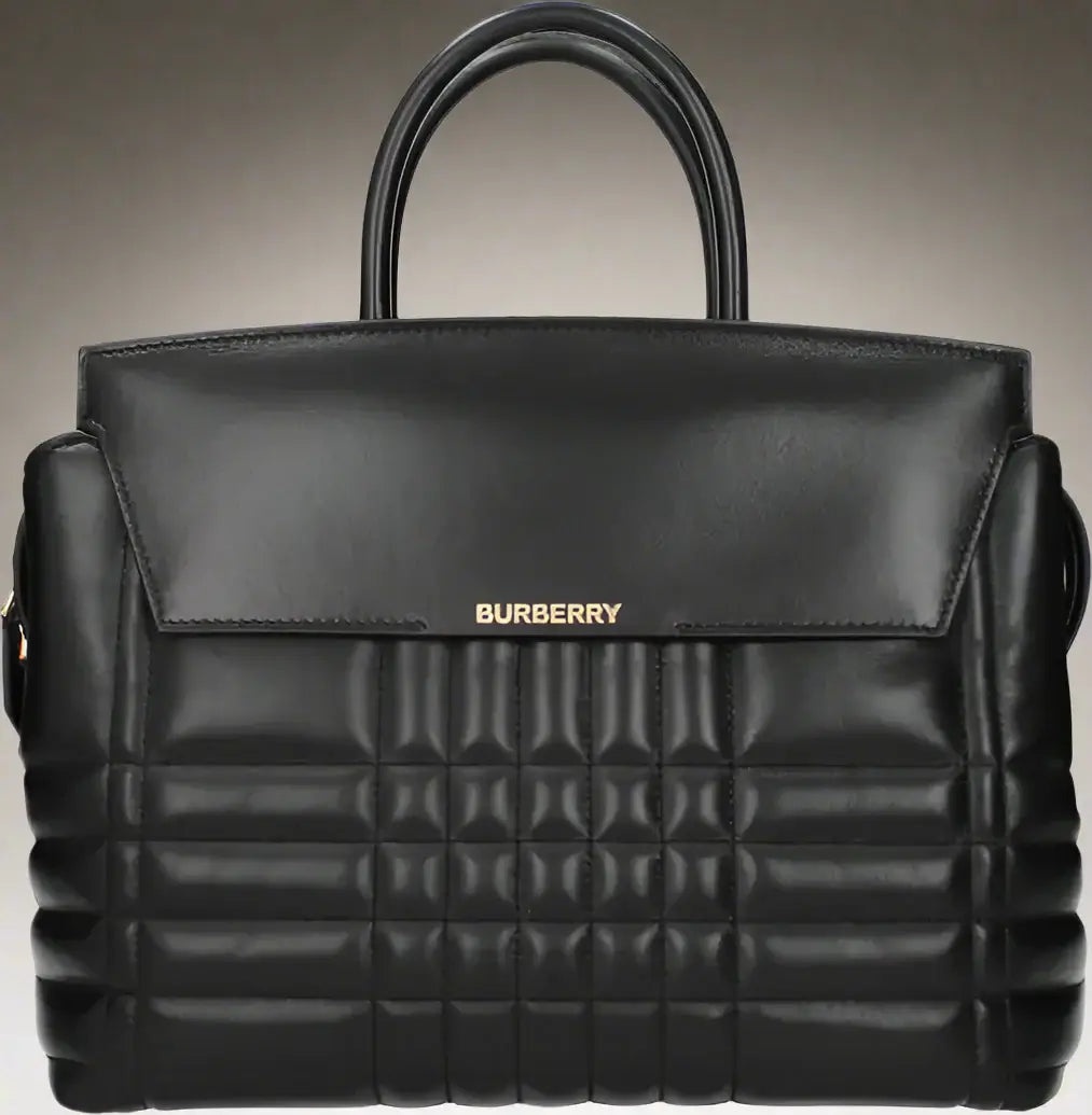 Black Burberry quilted handbag on a white background