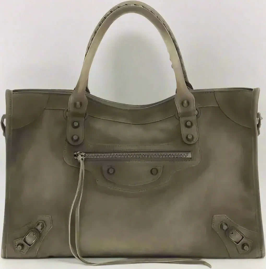 Green handbag with visible brand logo on a white background