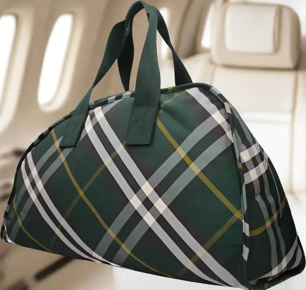 Green plaid duffel bag on a white background