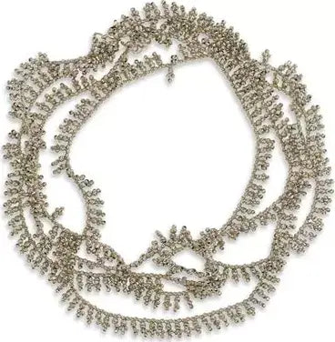 Silver necklace with intricate design on a white background
