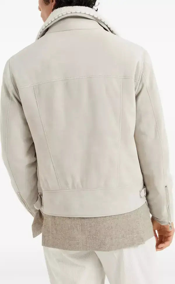 Light gray jacket worn by a person on a white background