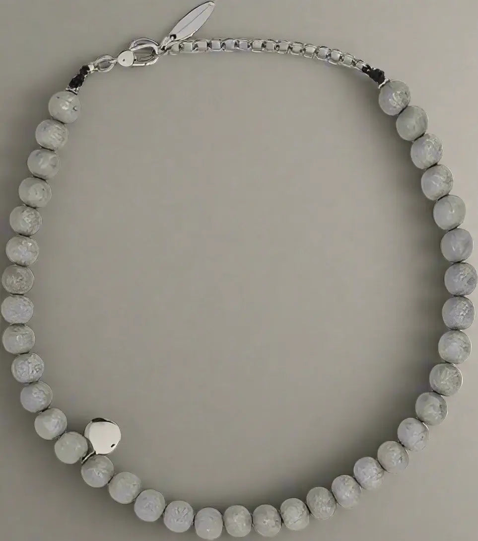 Necklace with gray beads on a white background