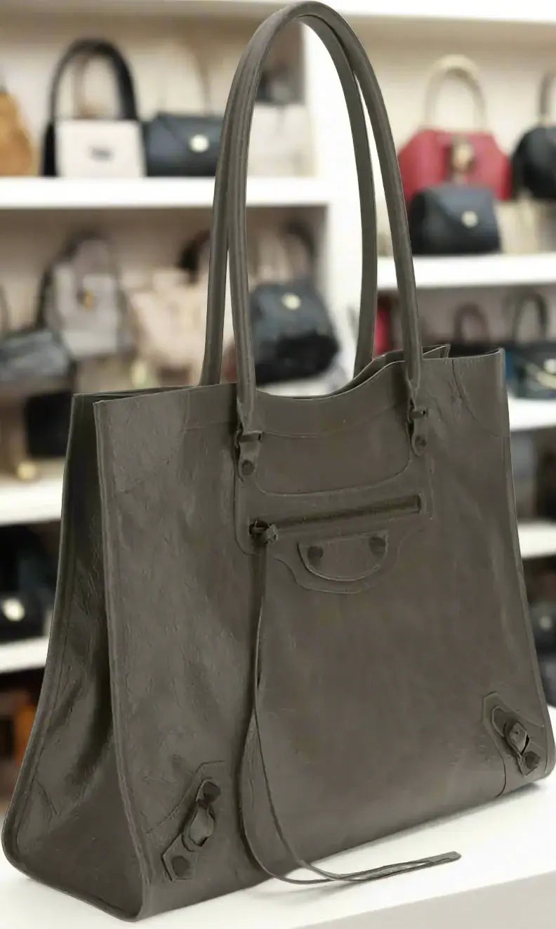 Gray leather tote bag on a white background