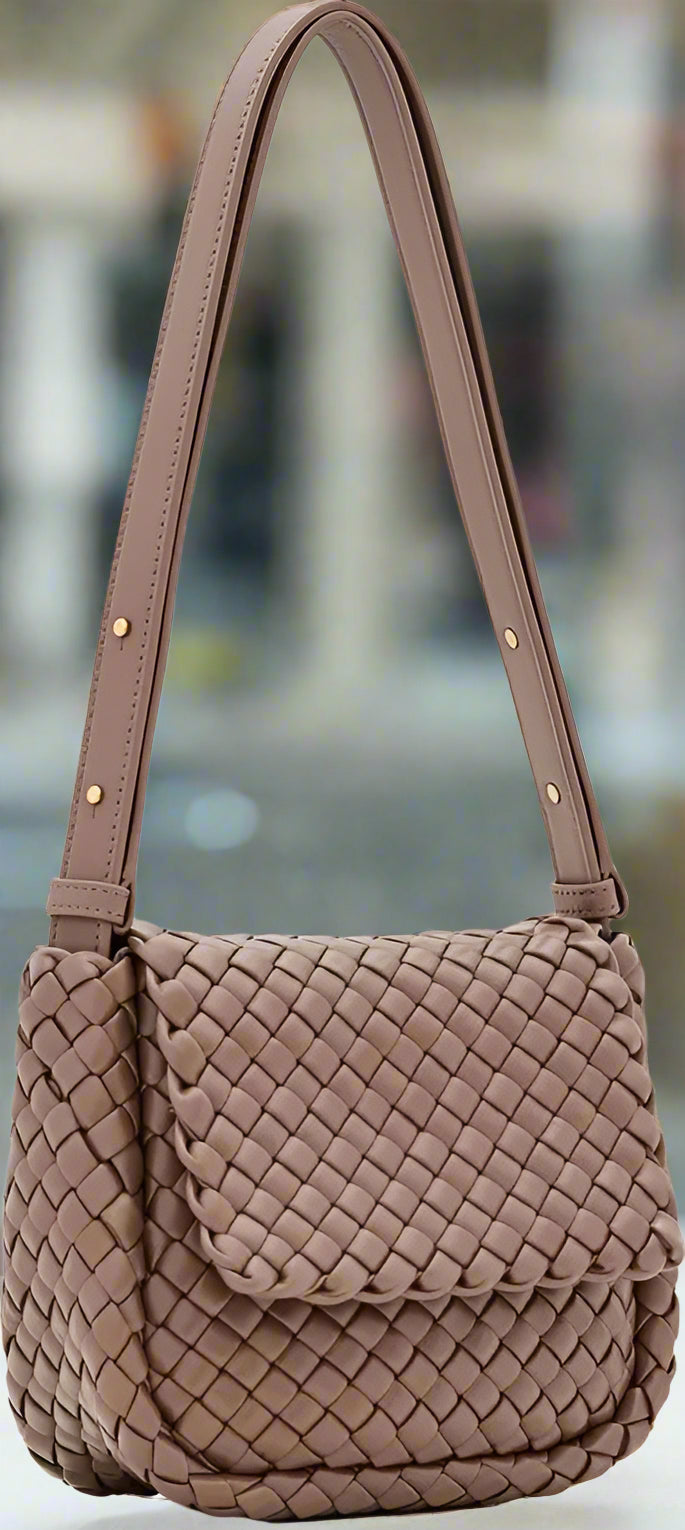 Quilted handbag with a strap on a white background