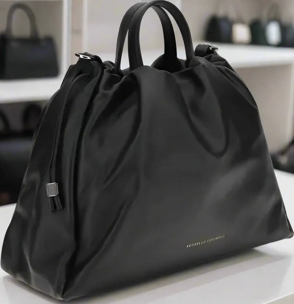 Black drawstring bag on a white background
