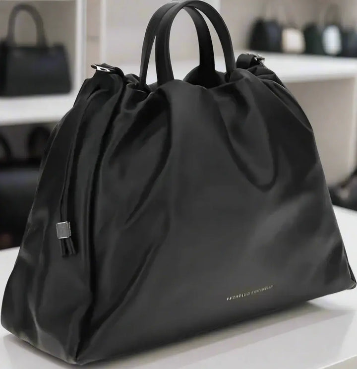 Black drawstring bag on a white background