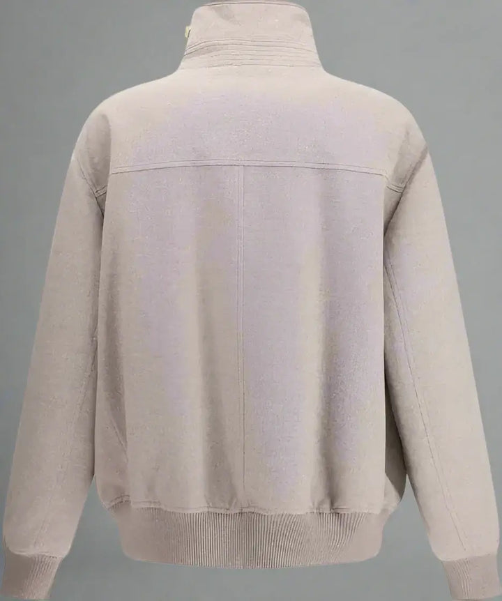 Beige sweater with a high collar on a white background
