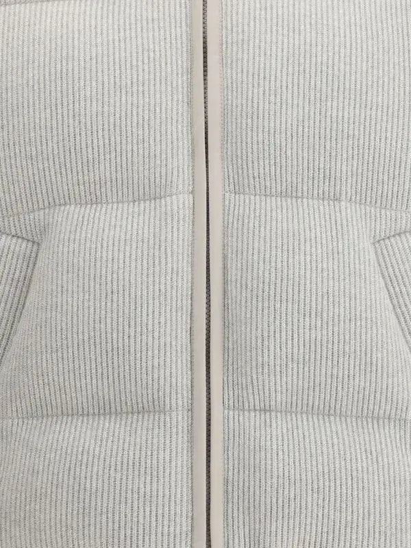 Close-up of a textured gray fabric with a zipper