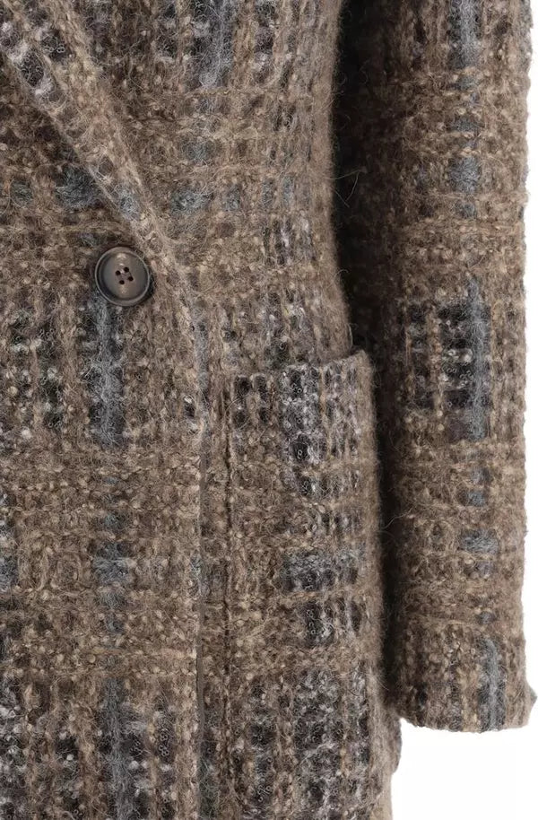 Close-up of a patterned coat with a button on a white background