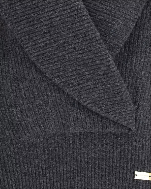 Dark gray textured fabric with a brand label in the corner
