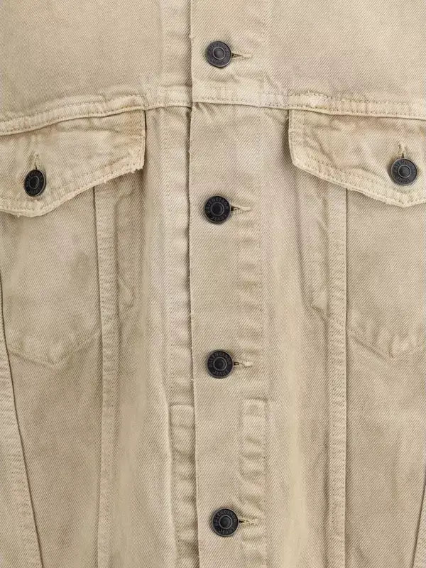 Close-up of a beige jacket with black buttons