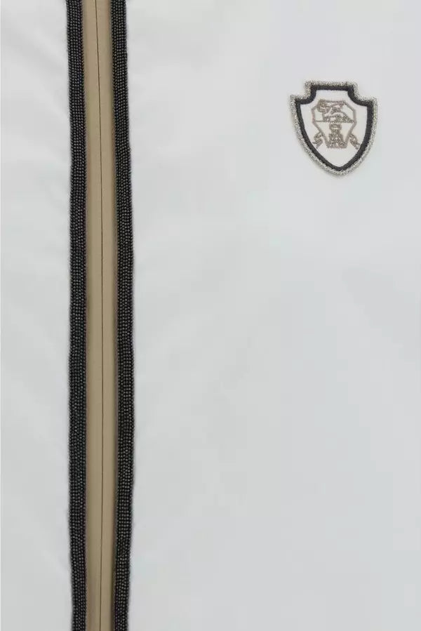 Close-up of a jacket with a zipper and a brand logo on a white background