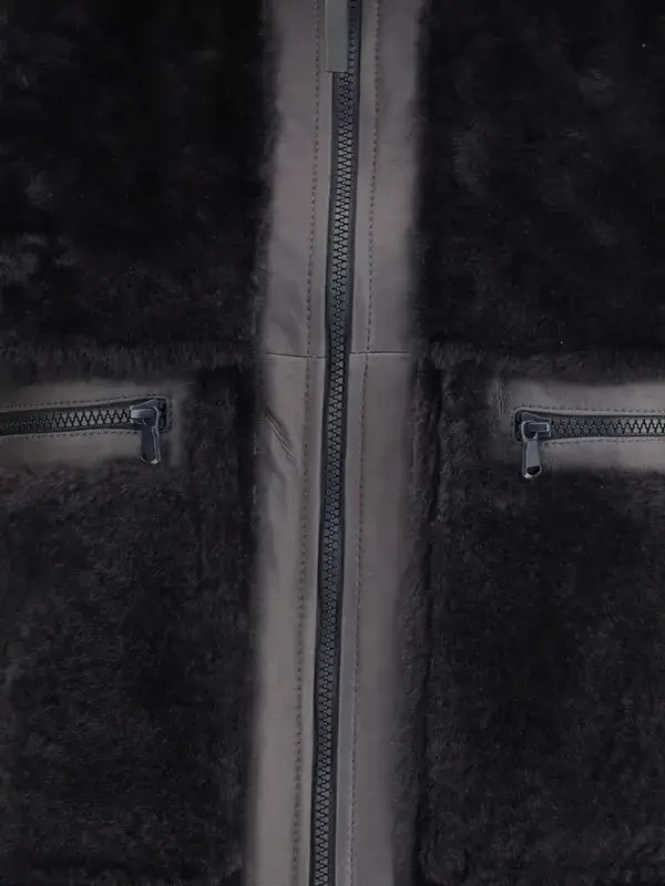 Close-up of a dark gray fleece jacket with zipper details