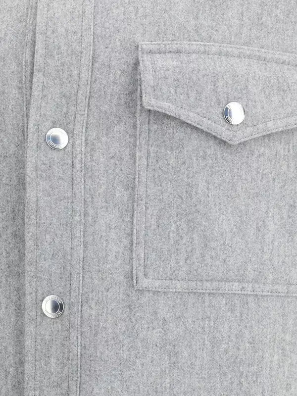 Close-up of a gray shirt with button details