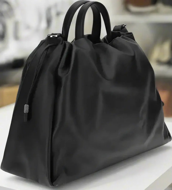Black drawstring bag on a white background
