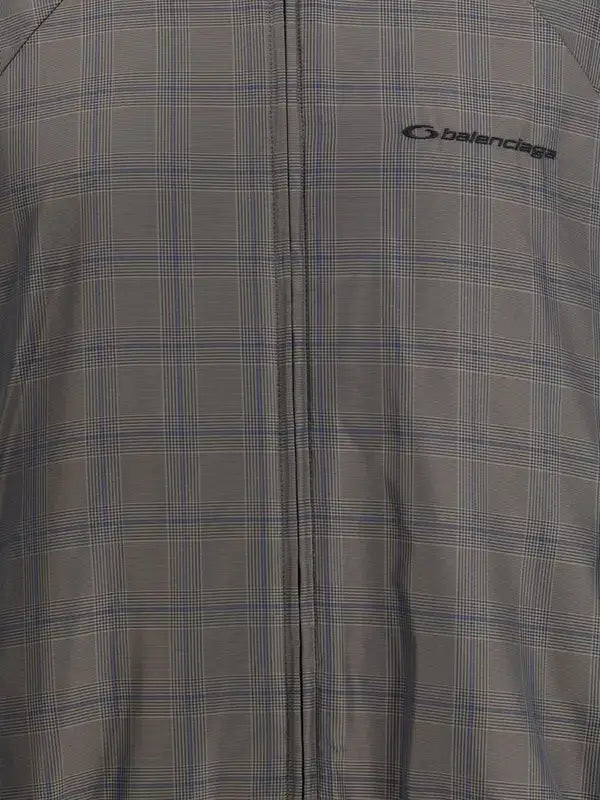 Gray checkered jacket with Balenciaga logo on a gray background