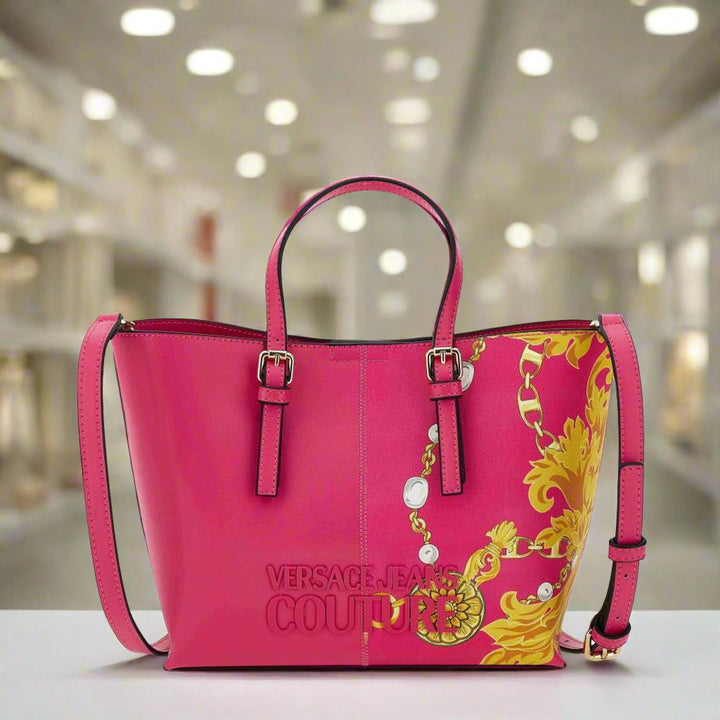 Versace Jeans Couture pink shopping bag with gold emblem, synthetic leather, removable shoulder strap and two handles.