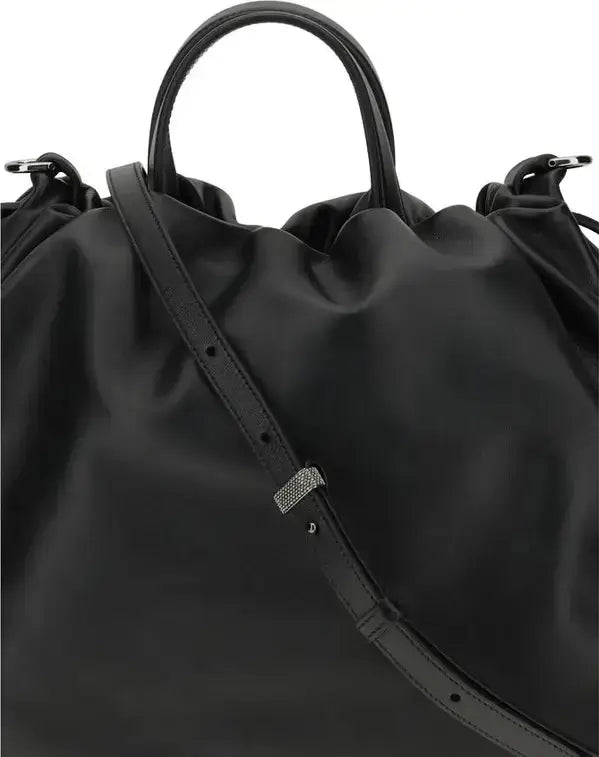 Black drawstring bag with a visible brand logo on a white background