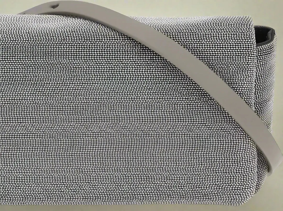 Gray textured bag with a strap on a white background