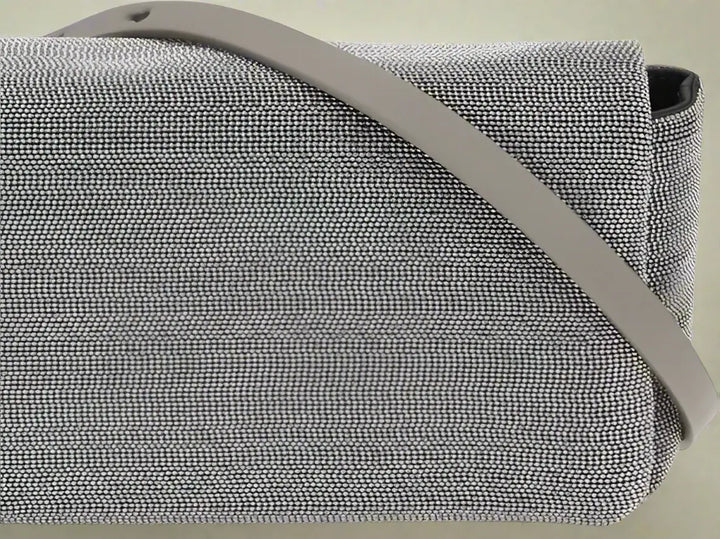 Gray textured bag with a strap on a white background
