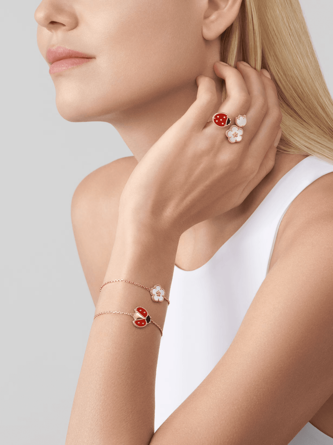 Van Cleef & Arpels Lucky Spring bracelet, plum blossom 18K rose gold, Mother-of-pearl worn elegantly by a model.
