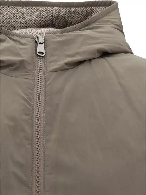 Close-up of a brown jacket with a zipper on a white background