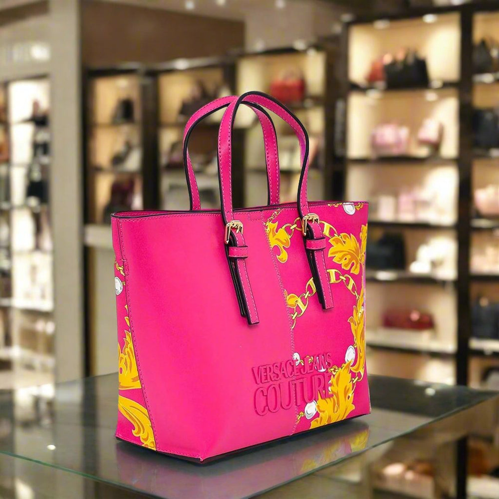 Versace Jeans Couture pink shopping bag with gold emblem, synthetic leather, stylish design for women.
