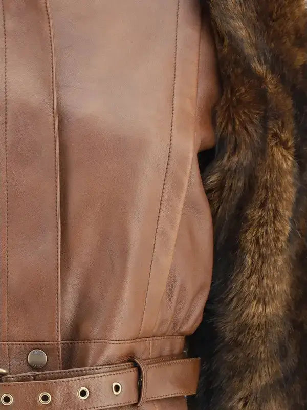 Close-up of a brown leather jacket with fur trim