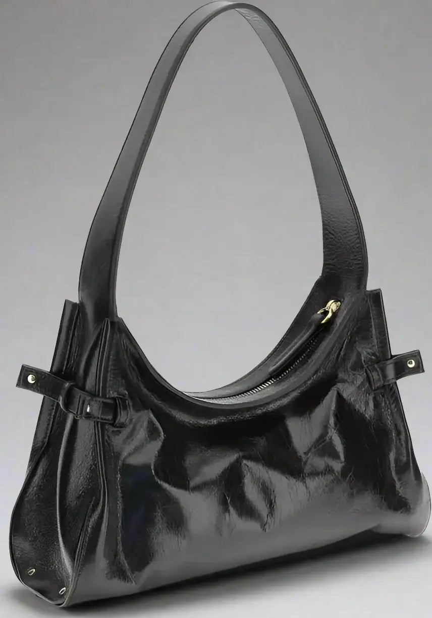 Black handbag with a strap on a white background